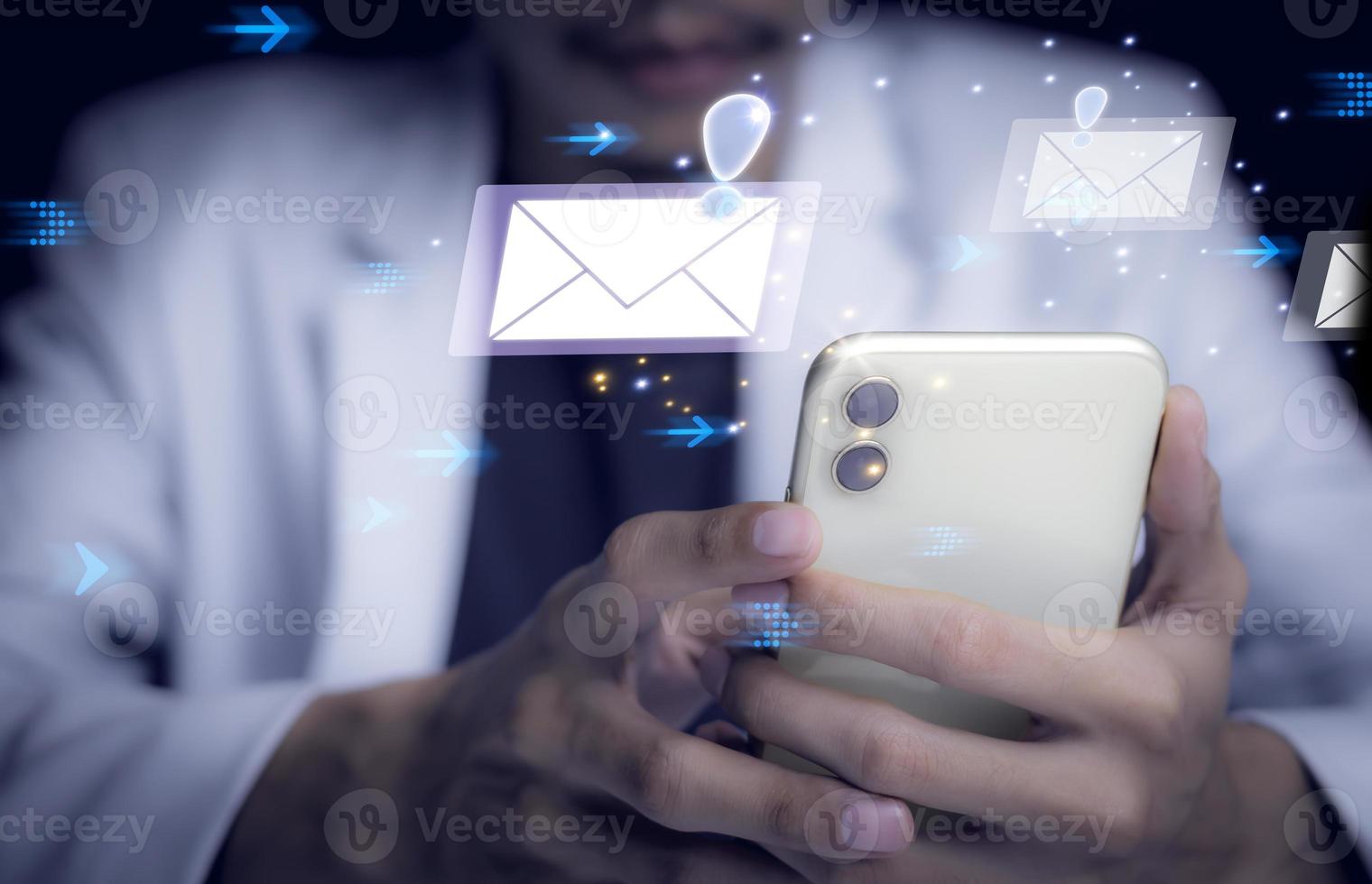 Businessman touching smartphone with open e-mail, receiving business e-mail news alerts Advertising by sending and customer messaging. online digital technology direct selling business, reminder. photo