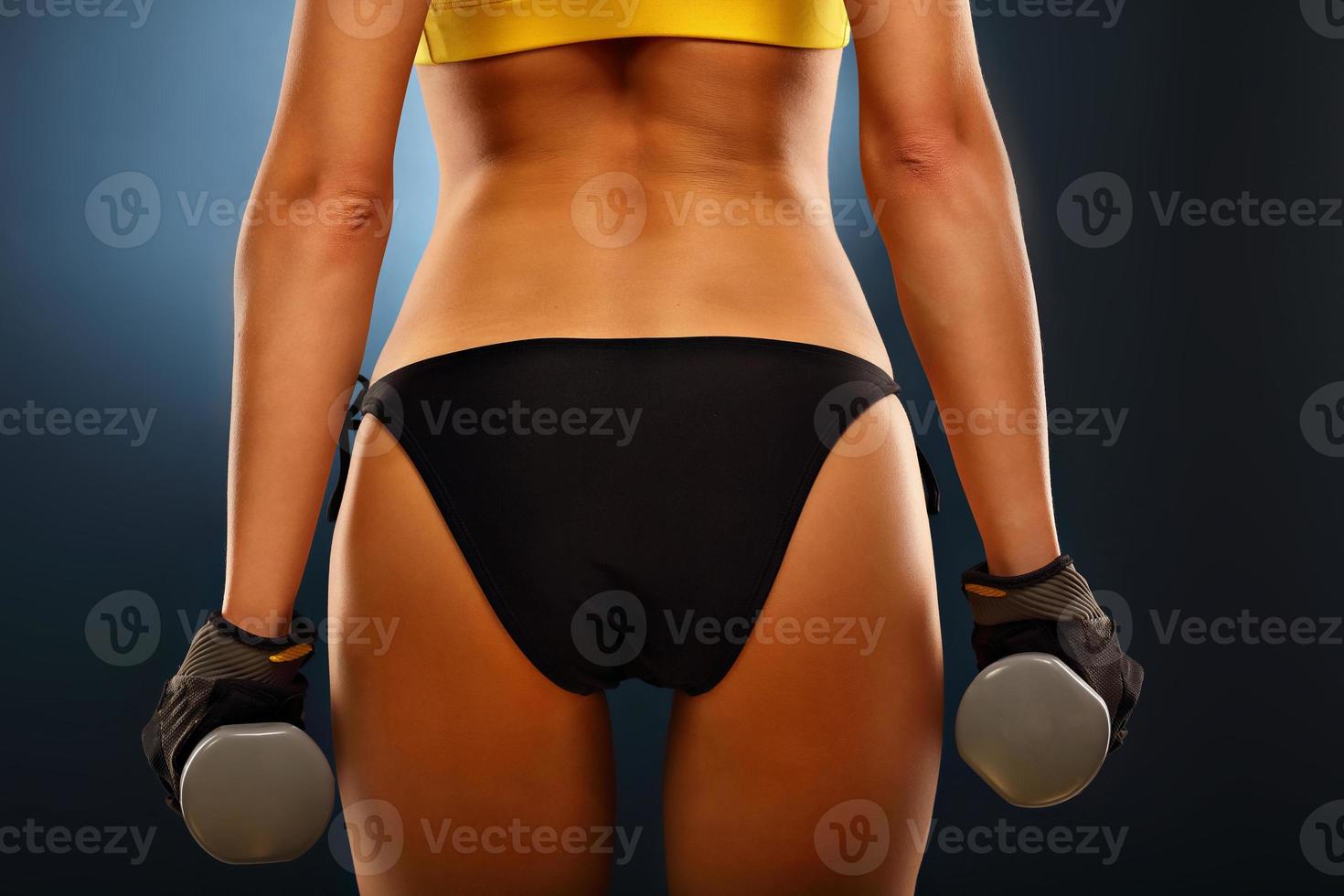 Woman lifting dumbells photo
