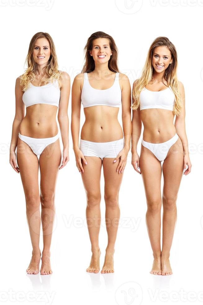 Group of happy friends posing in underwear photo