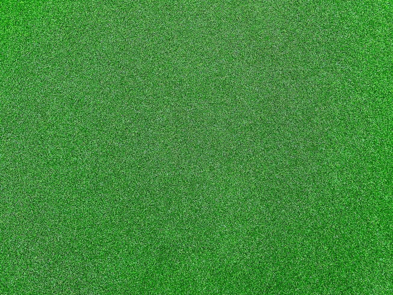 Green grass texture background grass garden top view. Concept used for making green background football pitch, Grass Golf,  green lawn pattern textured background. photo