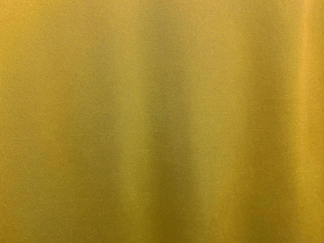 Yellow cotton fabric texture used as background. Empty yellow fabric background of soft and smooth textile material. There is space for text.. photo