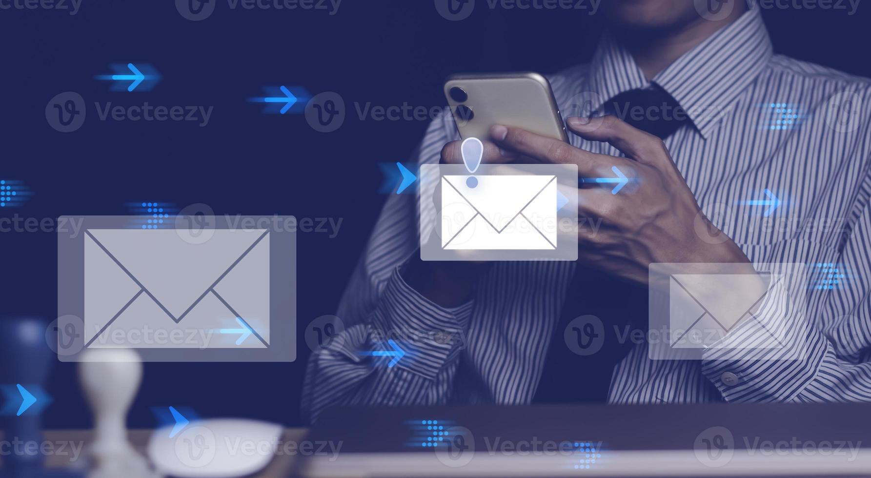 Businessman touching smartphone with open e-mail, receiving business e-mail news alerts Advertising by sending and customer messaging. online digital technology direct selling business, reminder. photo