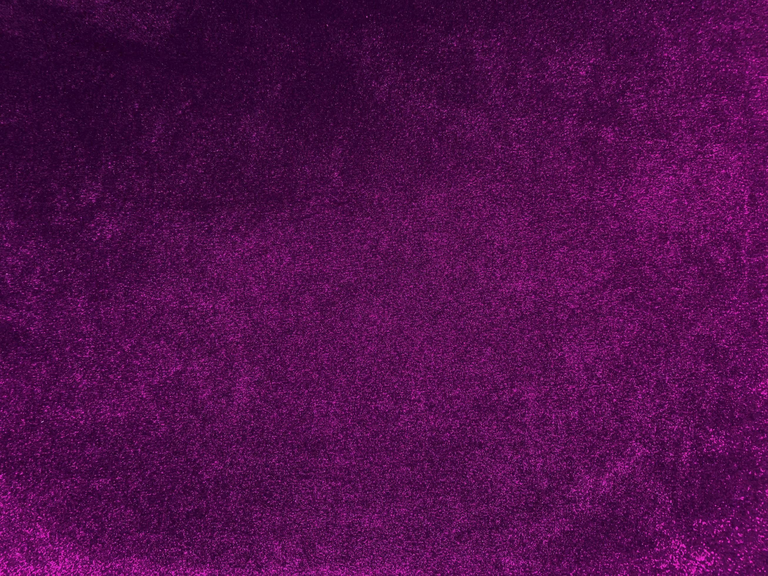 Purple velvet fabric texture used as background. Empty purple fabric