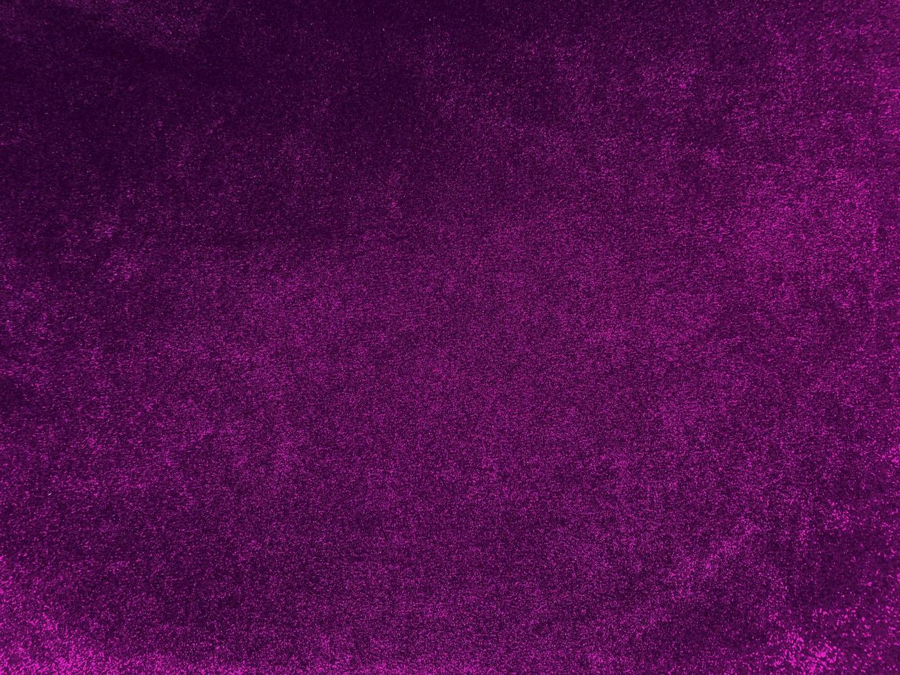 Purple velvet fabric texture used as background. Empty purple fabric background of soft and