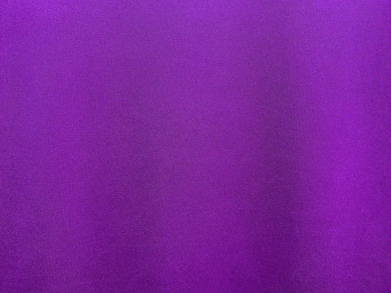 Purple cotton fabric texture used as background. Purple fabric background of soft and smooth textile material. There is space for text.. photo