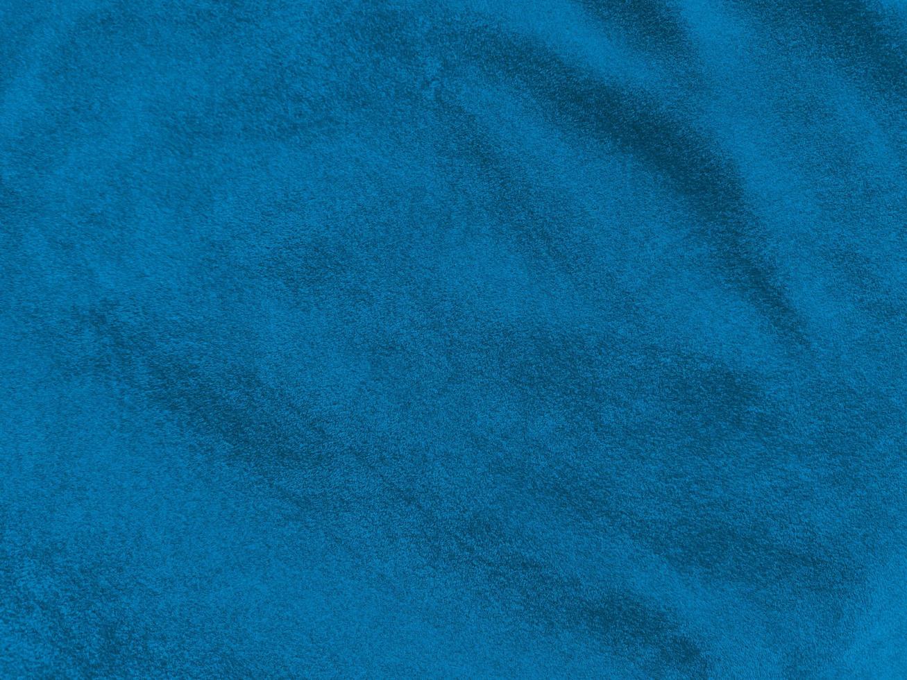 Dark blue velvet fabric texture used as background. Empty dark blue fabric background of soft and smooth textile material. There is space for text. photo