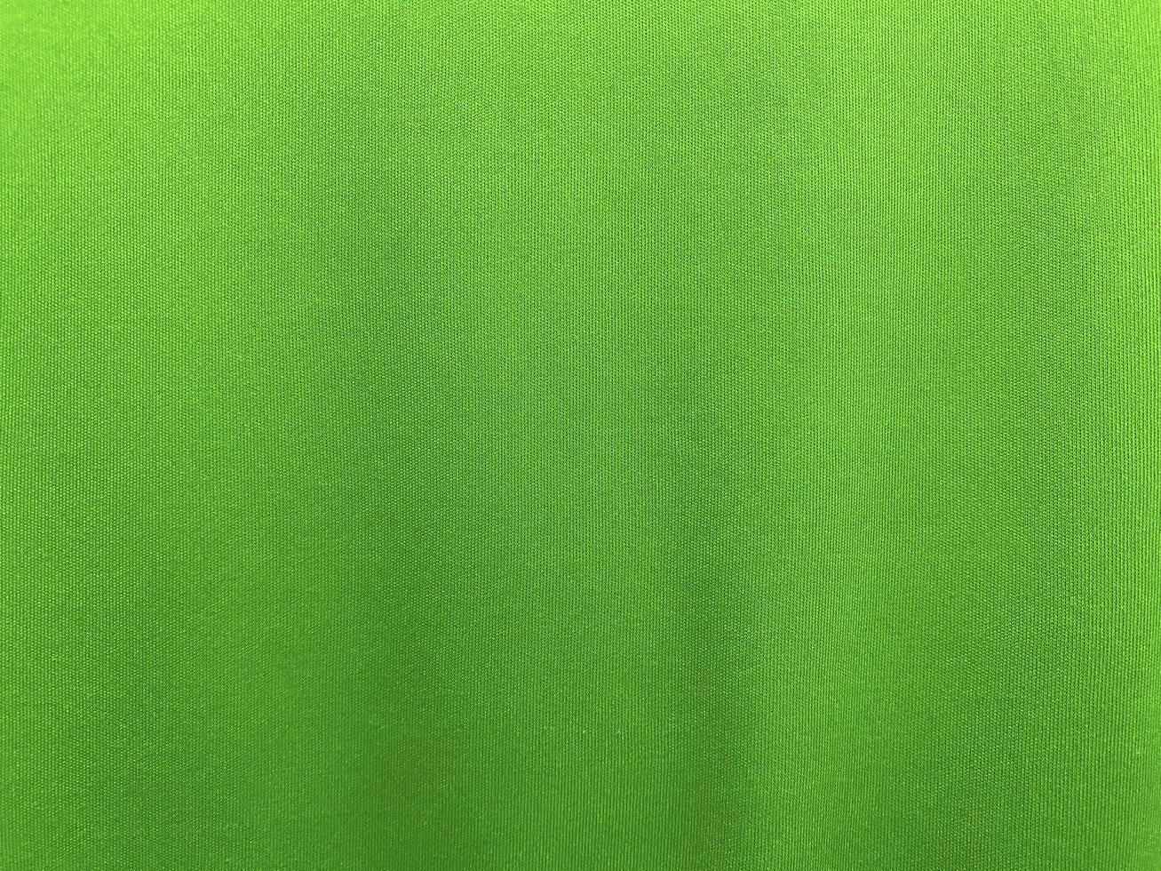 Green cotton fabric texture used as background. Empty green fabric background of soft and smooth textile material. There is space for text.. photo