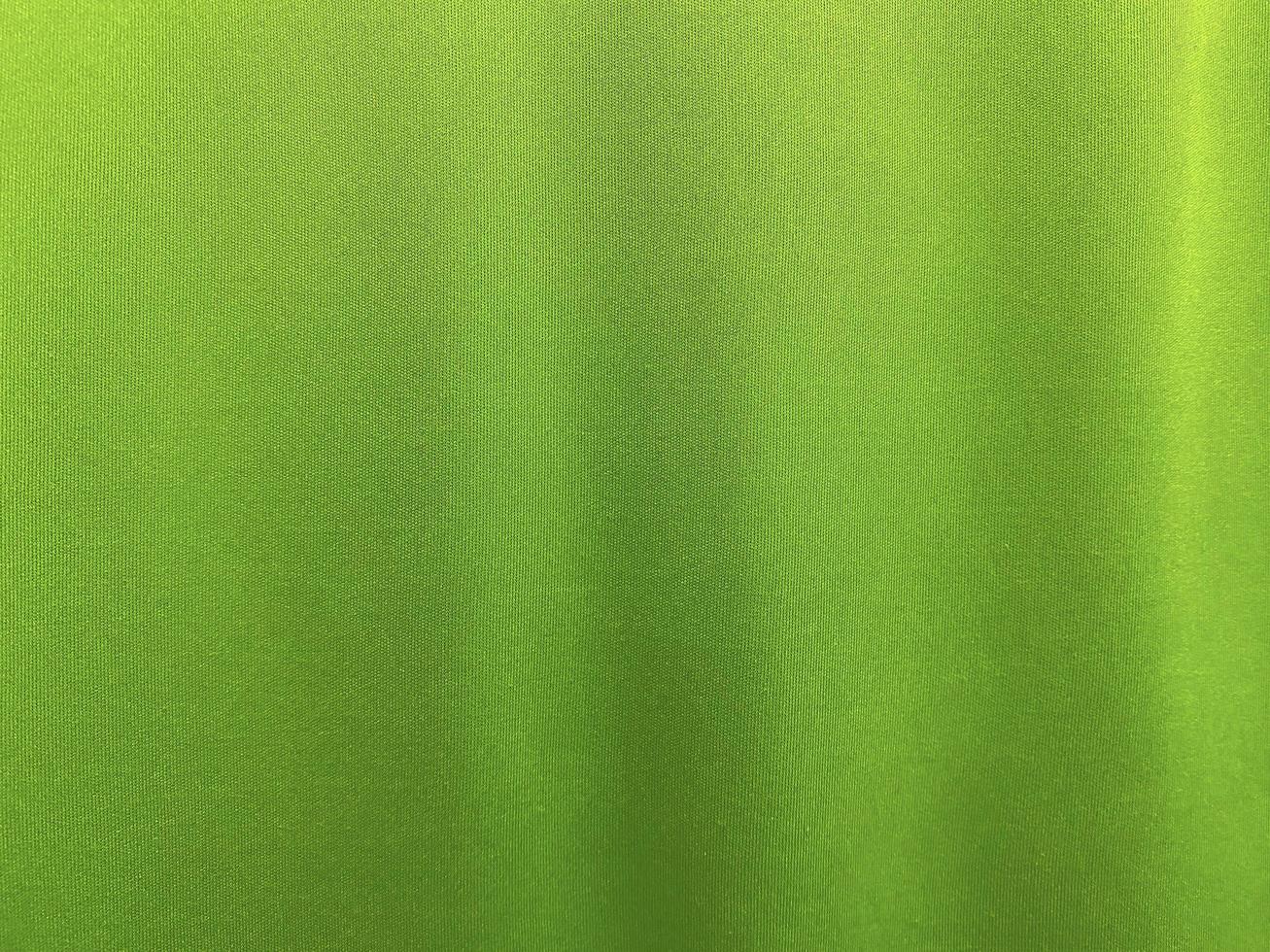 Green cotton fabric texture used as background. Empty green fabric background of soft and smooth textile material. There is space for text.. photo