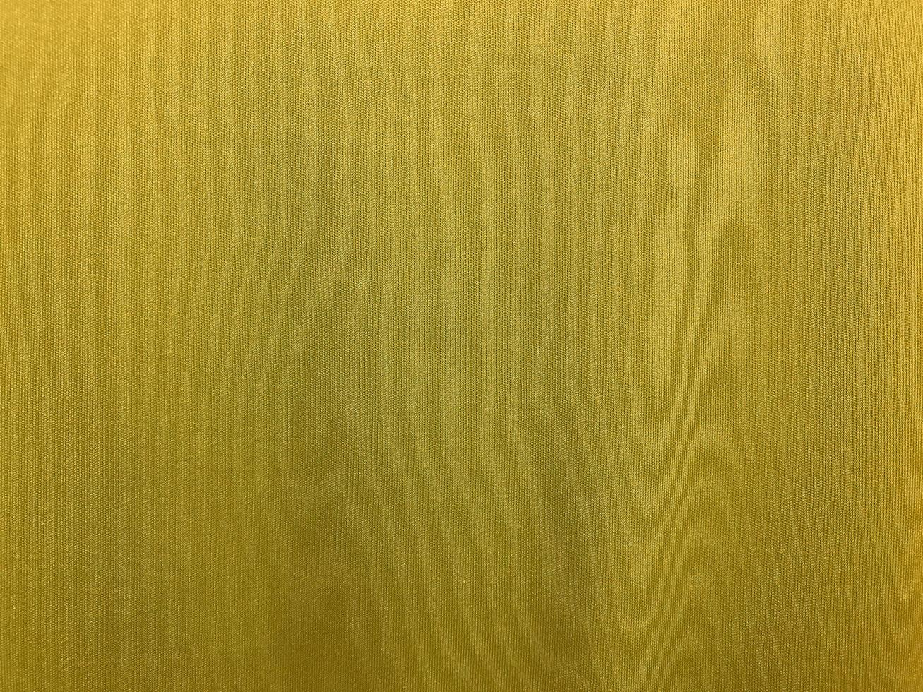 Yellow cotton fabric texture used as background. Empty yellow fabric background of soft and smooth textile material. There is space for text.. photo