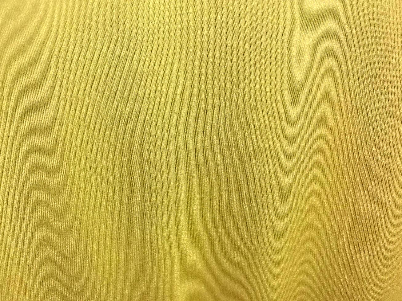 Yellow cotton fabric texture used as background. Empty yellow fabric background of soft and smooth textile material. There is space for text.. photo