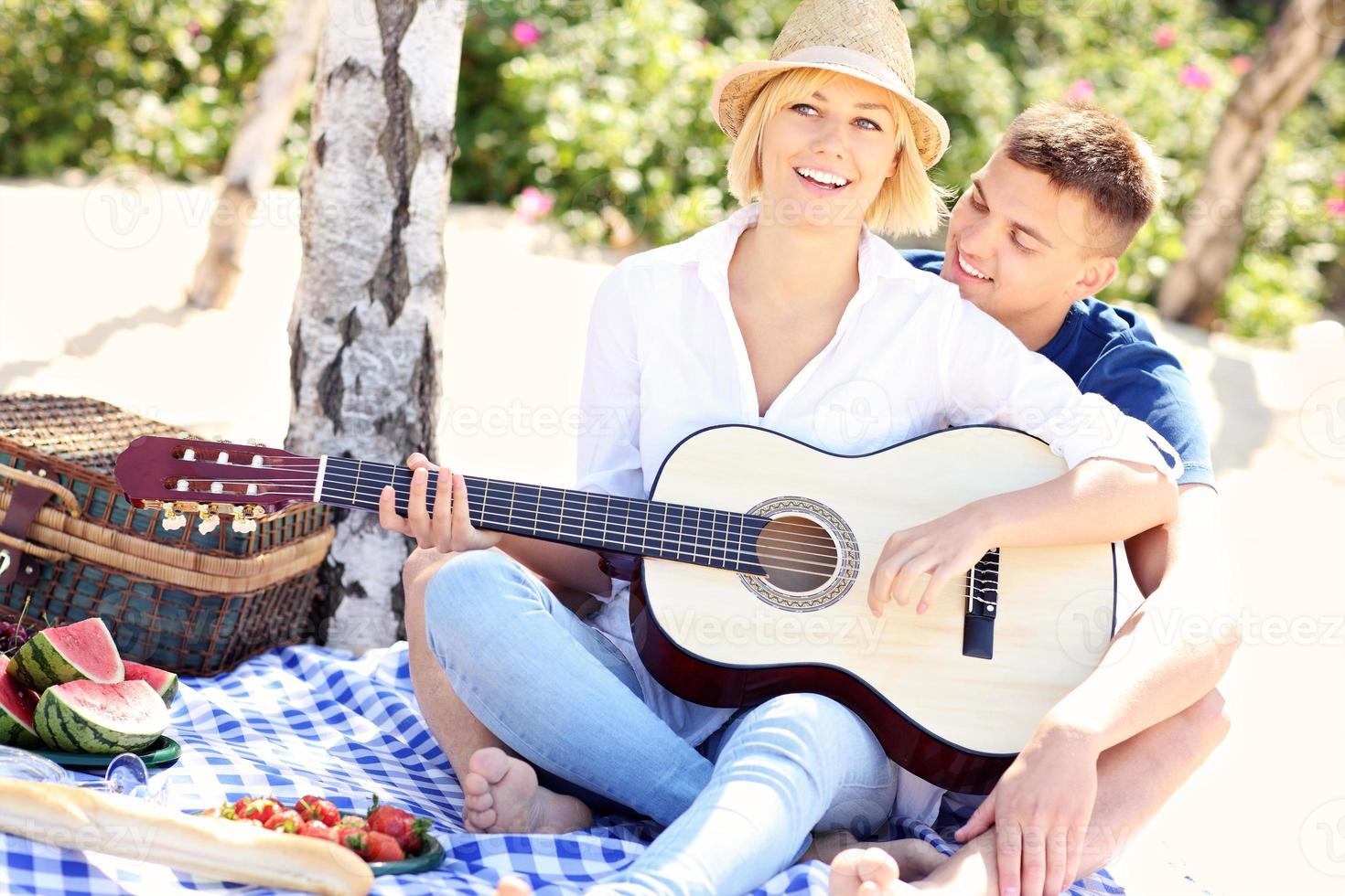 Adult couple and guitar photo
