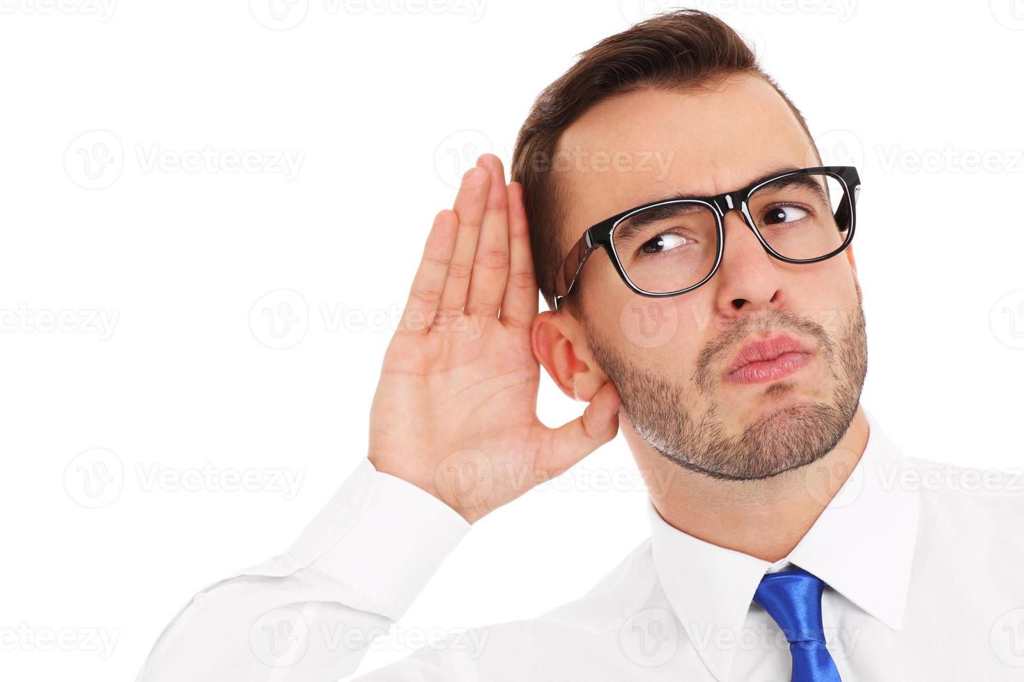 Happy businessman listening to something photo