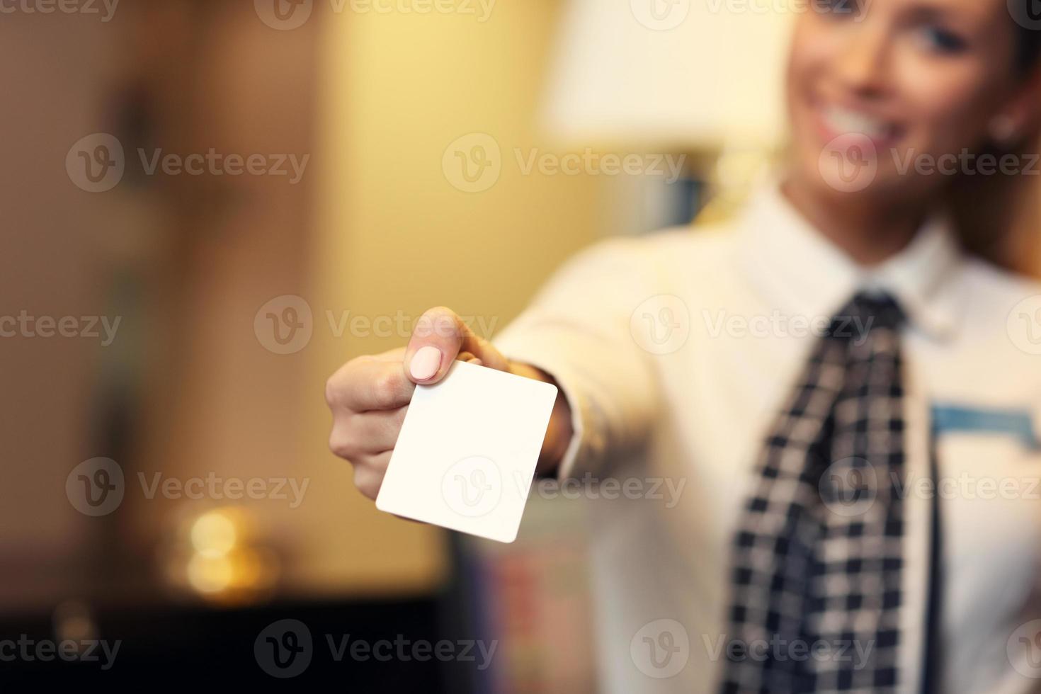 Receptionist with key card photo