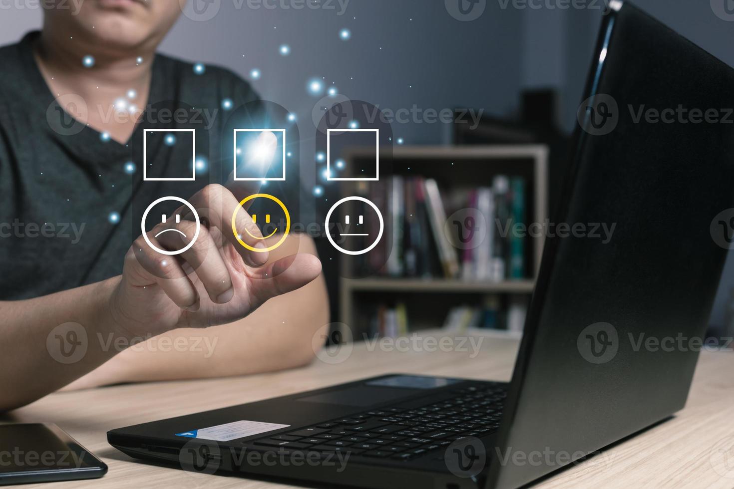 a businessman touching the virtual screen on the happy smile face icon to give satisfaction in service.rating very impressed.Customer service and Satisfaction concept photo