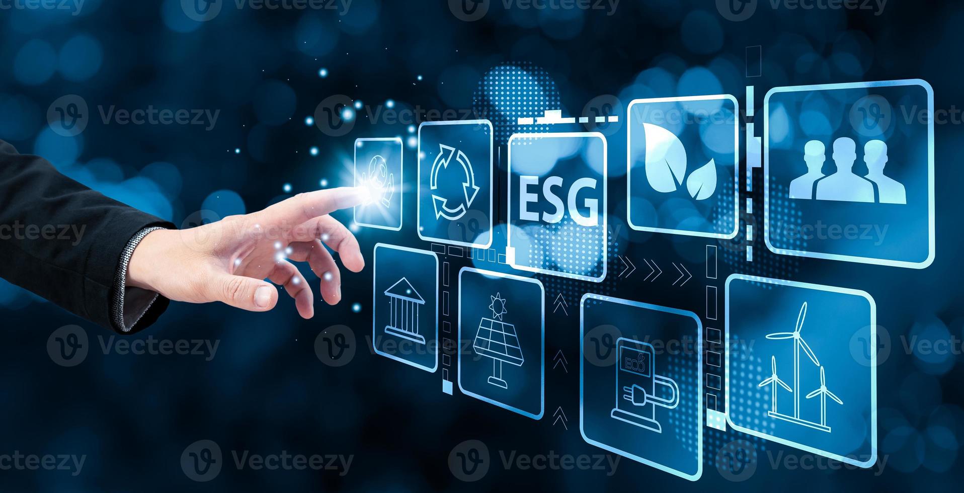 hand touch hologram screen to save energy,and reduce global warming,sustainable business investments,carbon credit,reducing greenhouse gas emissions,ESG for Environment Social and Governance. photo