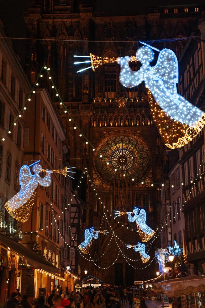 STRASBOURG, FRANCE - December 2021 - angel decoration in front of Cathedral Notre Dame photo