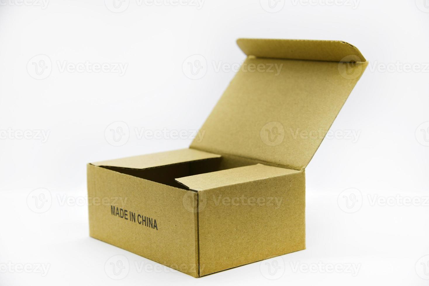 Cardboard box with the inscription made in China. A box on a white background. A small box made in China on a white background. photo