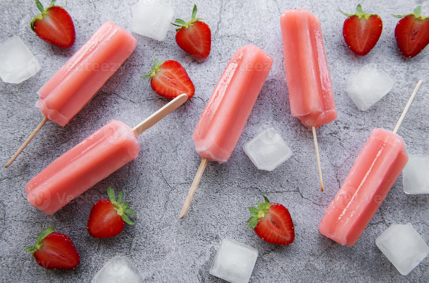 Strawberry ice cream popsicles photo