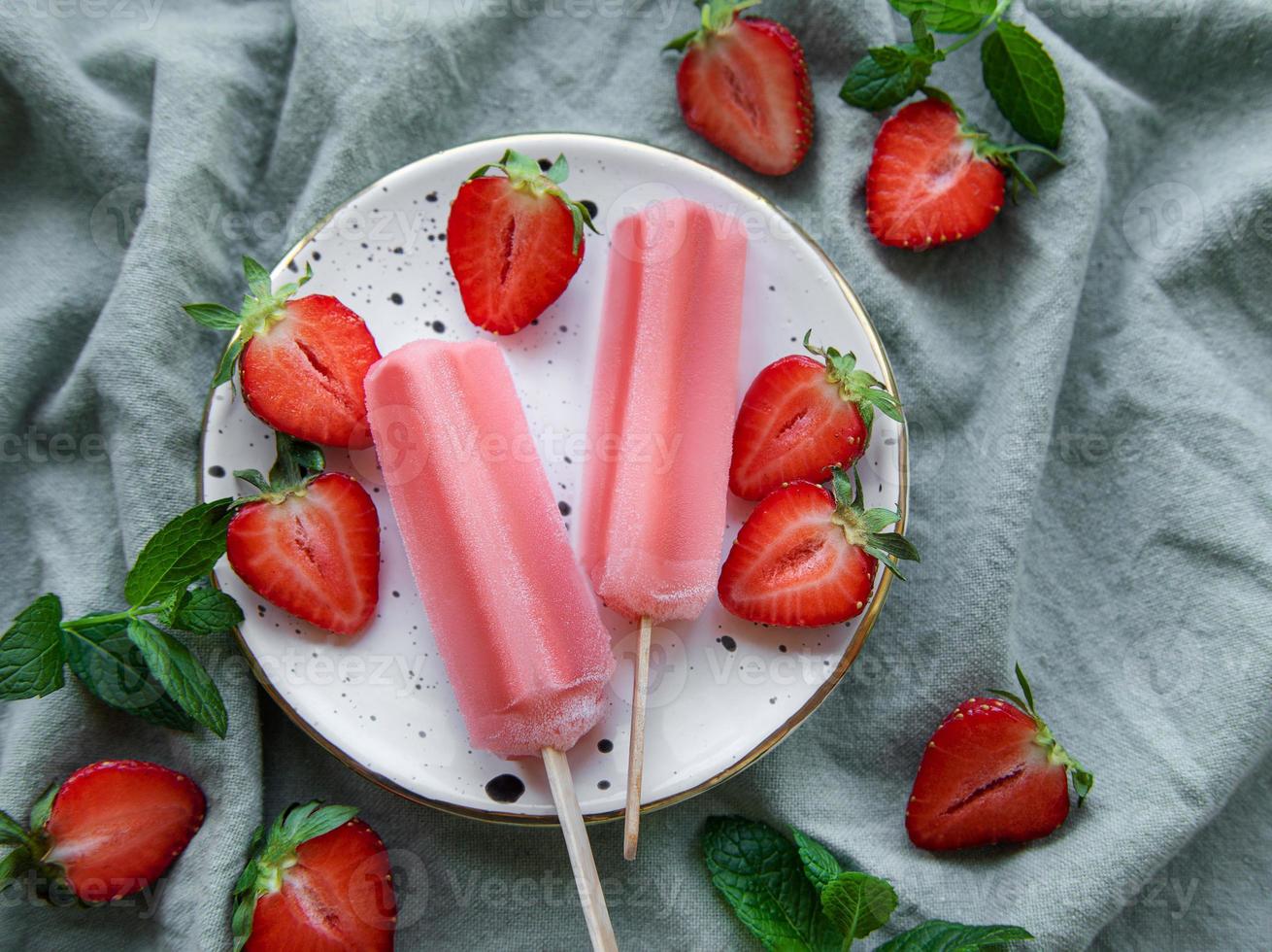 Strawberry ice cream popsicles photo