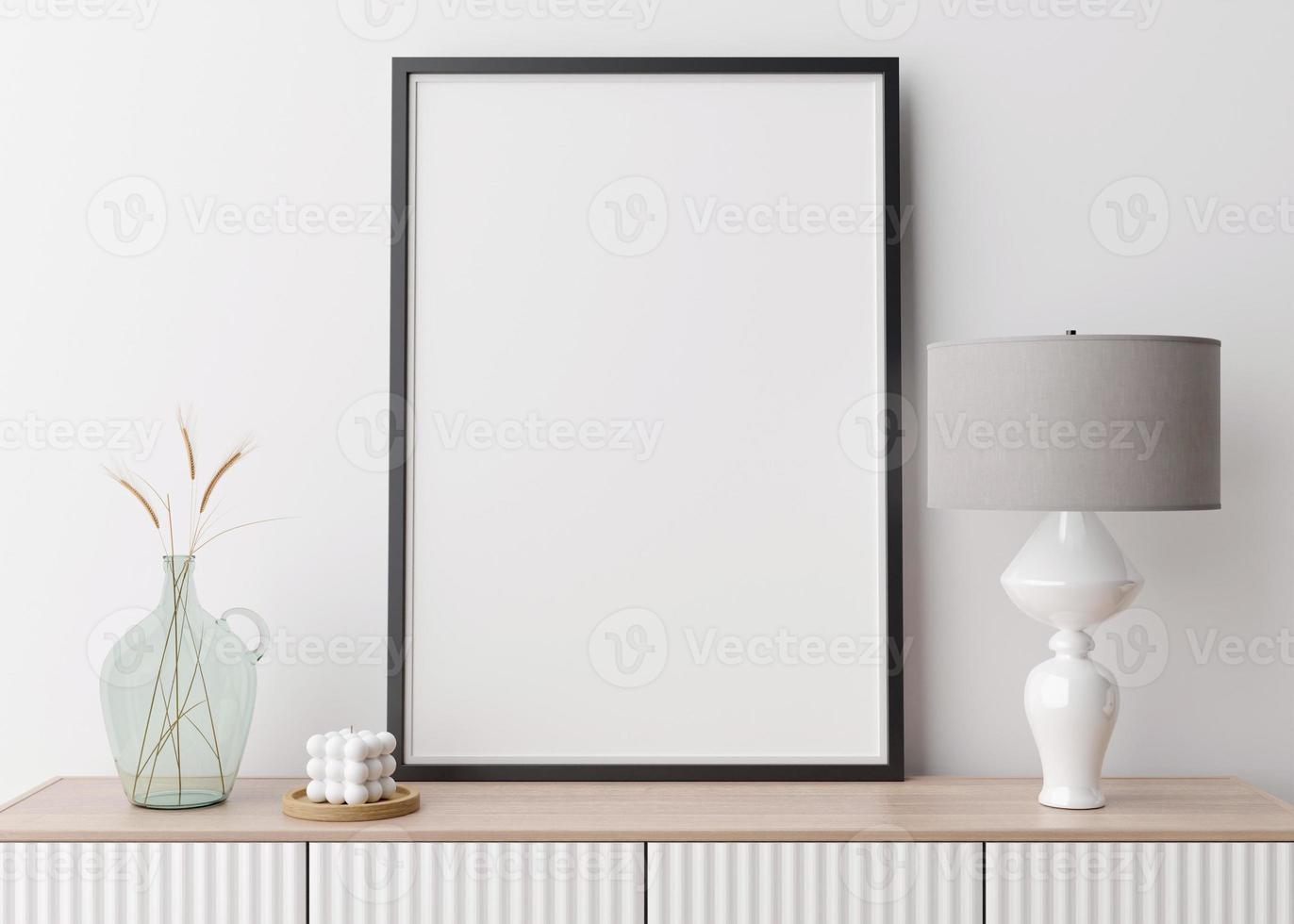 Empty vertical picture frame on white wall in modern living room. Mock up interior in contemporary style. Free space for picture, poster. Console, lamp, glass vase with grass, candle. 3D rendering. photo