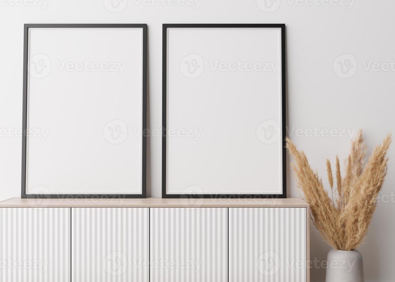 Two empty vertical picture frames standing on wooden sideboard. Mock up interior in contemporary style. Free space for picture, poster. Console, vase with pampas grass. 3D rendering. photo