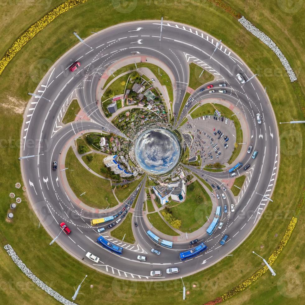 blue sphere inside overlooking old town, urban development, historic buildings and crossroads with cars. Transformation of spherical 360 panorama in abstract aerial view. photo