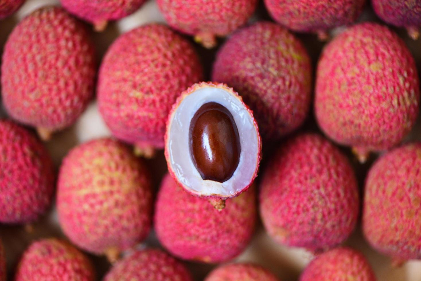 Lychee slice peeled texture background top view - Fresh lychee harvest in from tree tropical fruit summer in Thailand photo