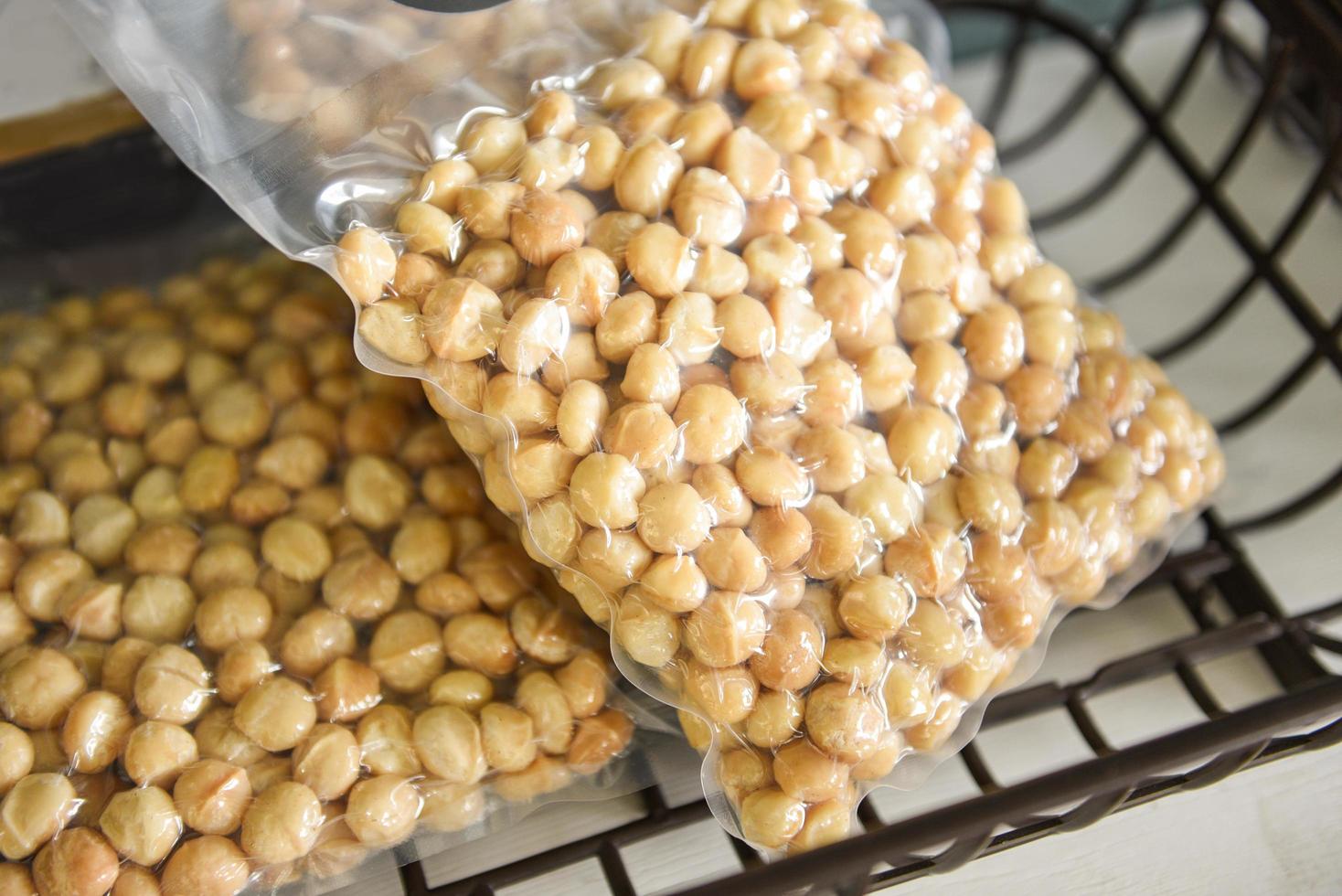 Macadamia nut shelled from natural high protein for to drying - macadamia nuts in vacuum packaging photo