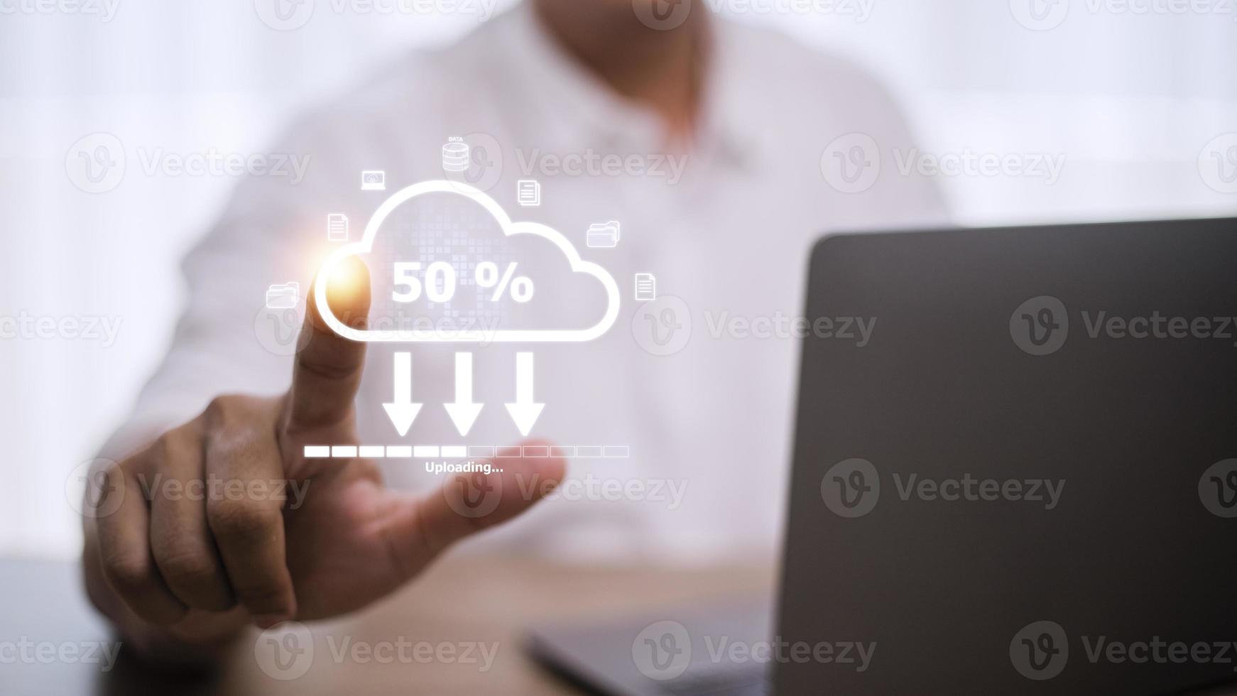 Cloud storage technology concept. Businessmen use laptops to synchronize documents or data to online storage. Upload and download files. Data sharing and transfer network. photo