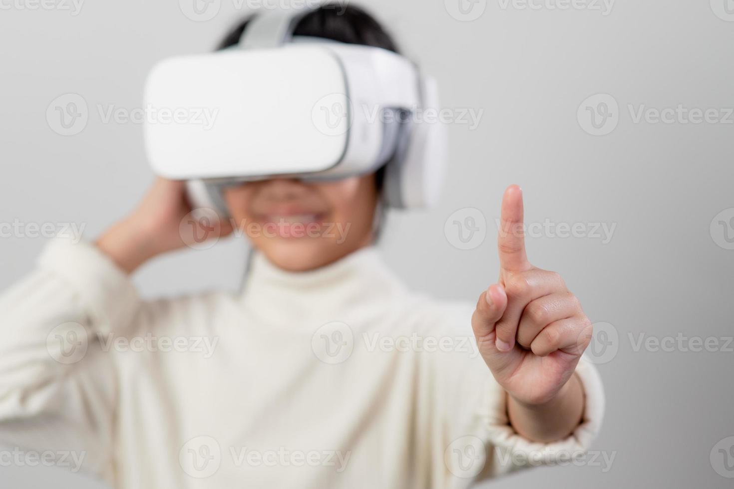 Asian little girl with virtual reality headset. Innovation technology and education concept photo