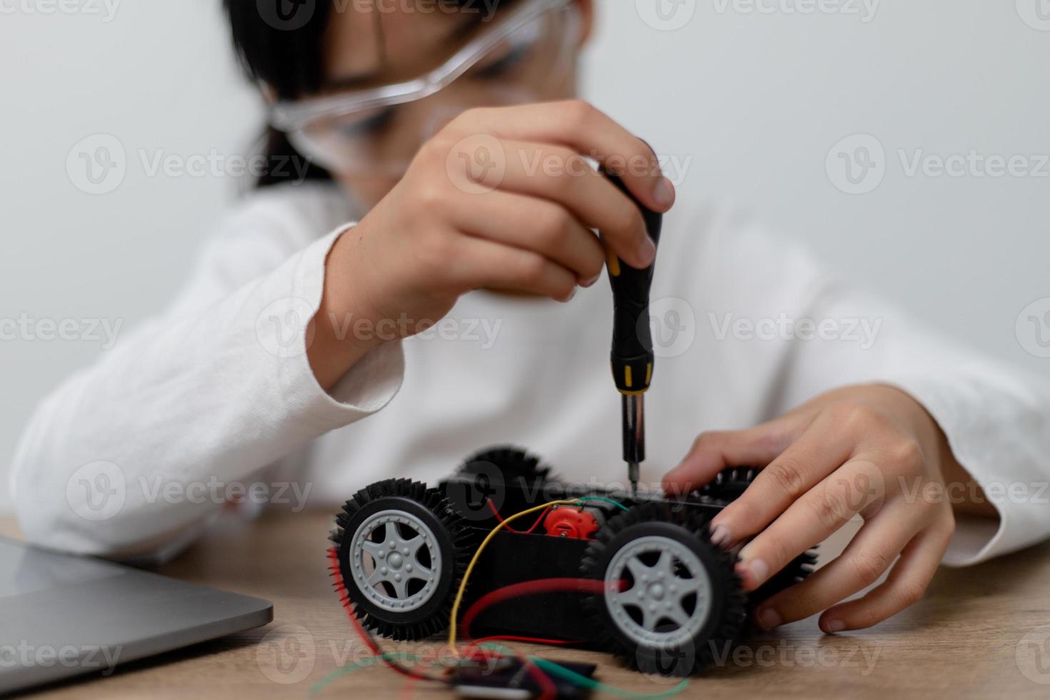 Asia students learn at home in coding robot cars and electronic