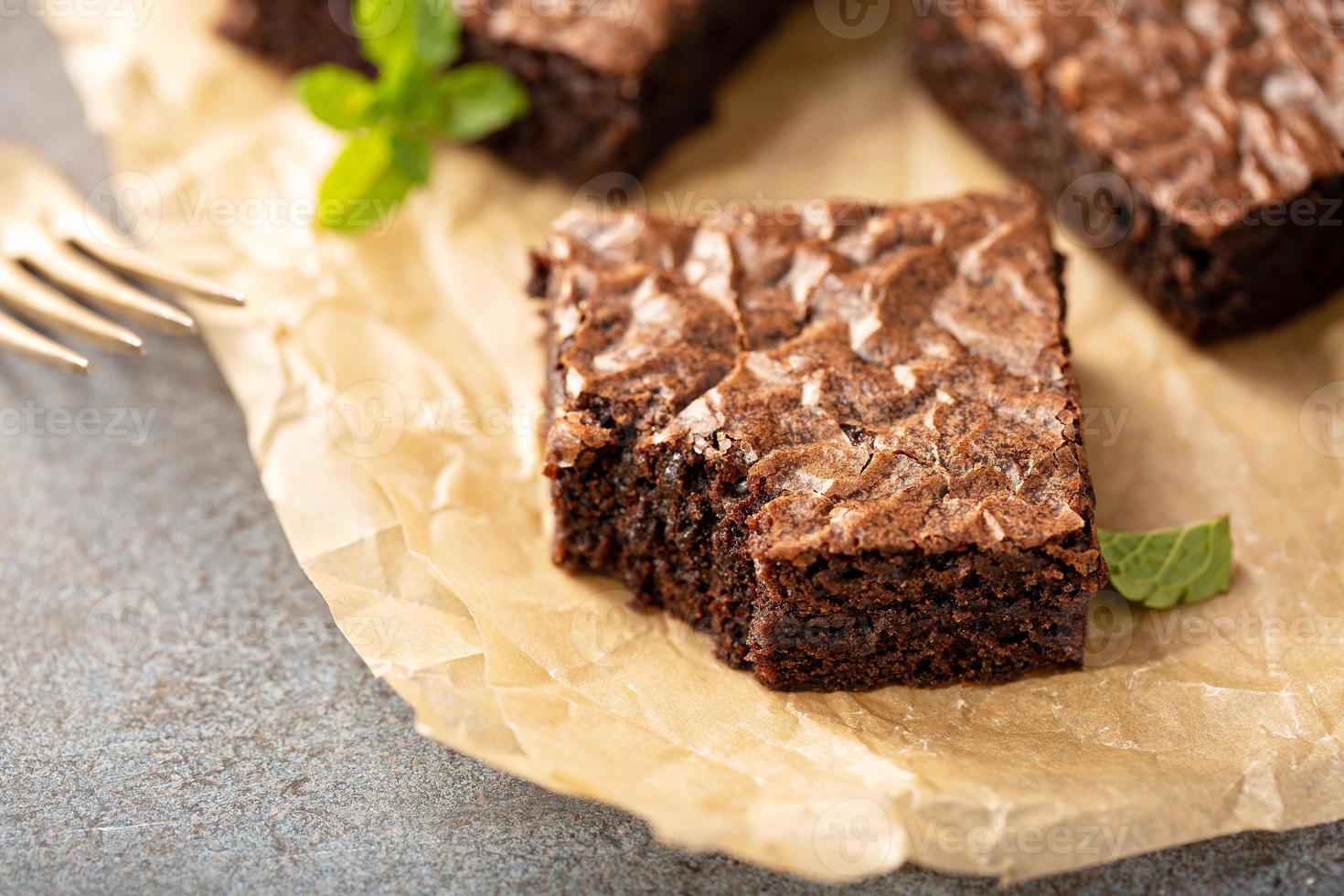 Freshly baked brownies on a parchment paper 15943776 Stock Photo at