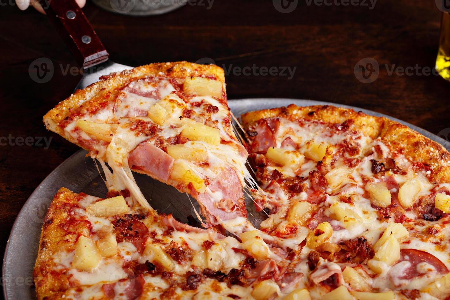 Hawaiian pizza with ham and pineapple photo