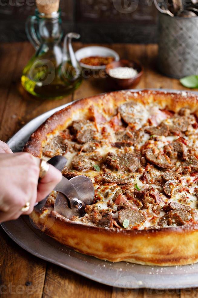Deep dish meat pizza 15944438 Stock Photo at Vecteezy