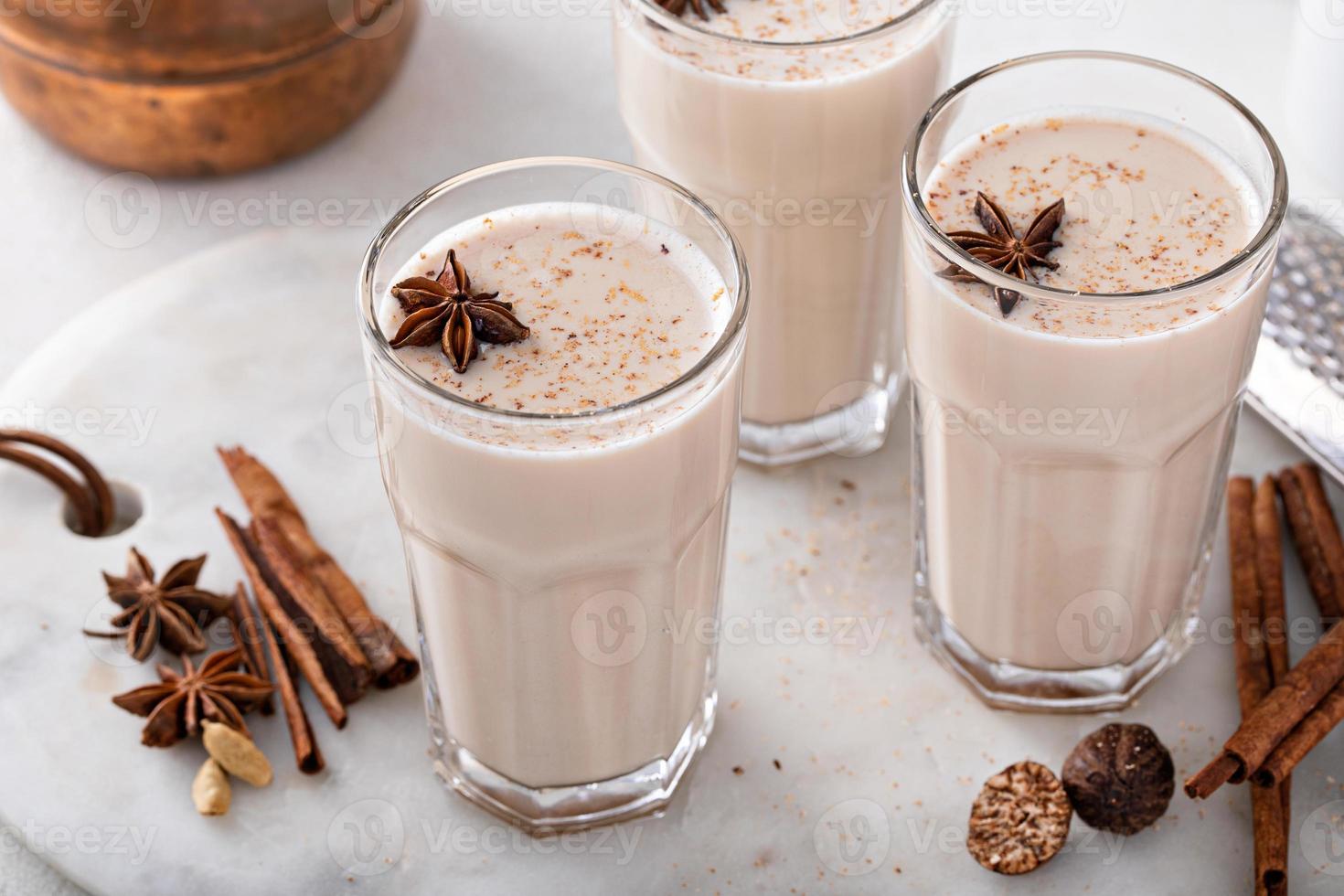 Chai in tall glasses with whole spices photo