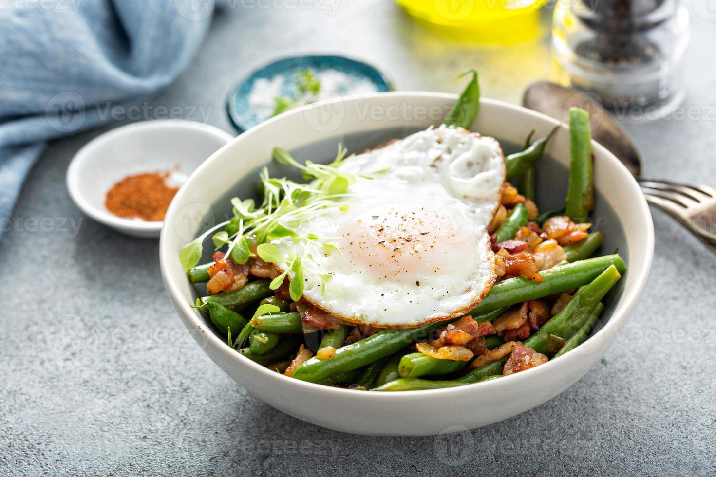 Healthy and filling breakfast with egg, green beans and bacon photo