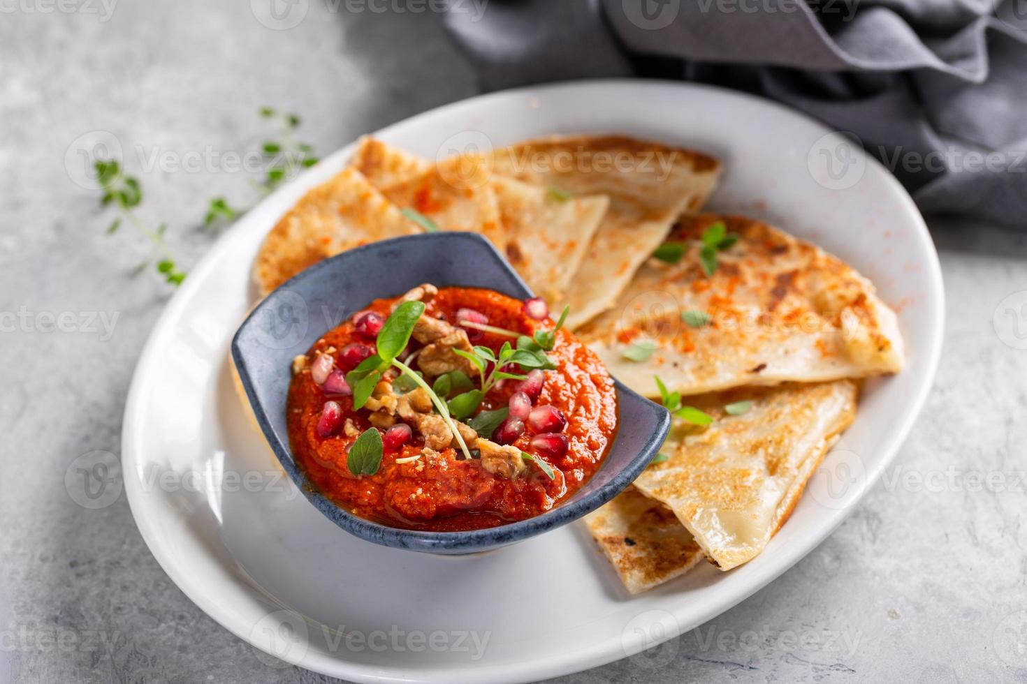 Flatbread served with spicy dipping sauce 15944831 Stock Photo at Vecteezy