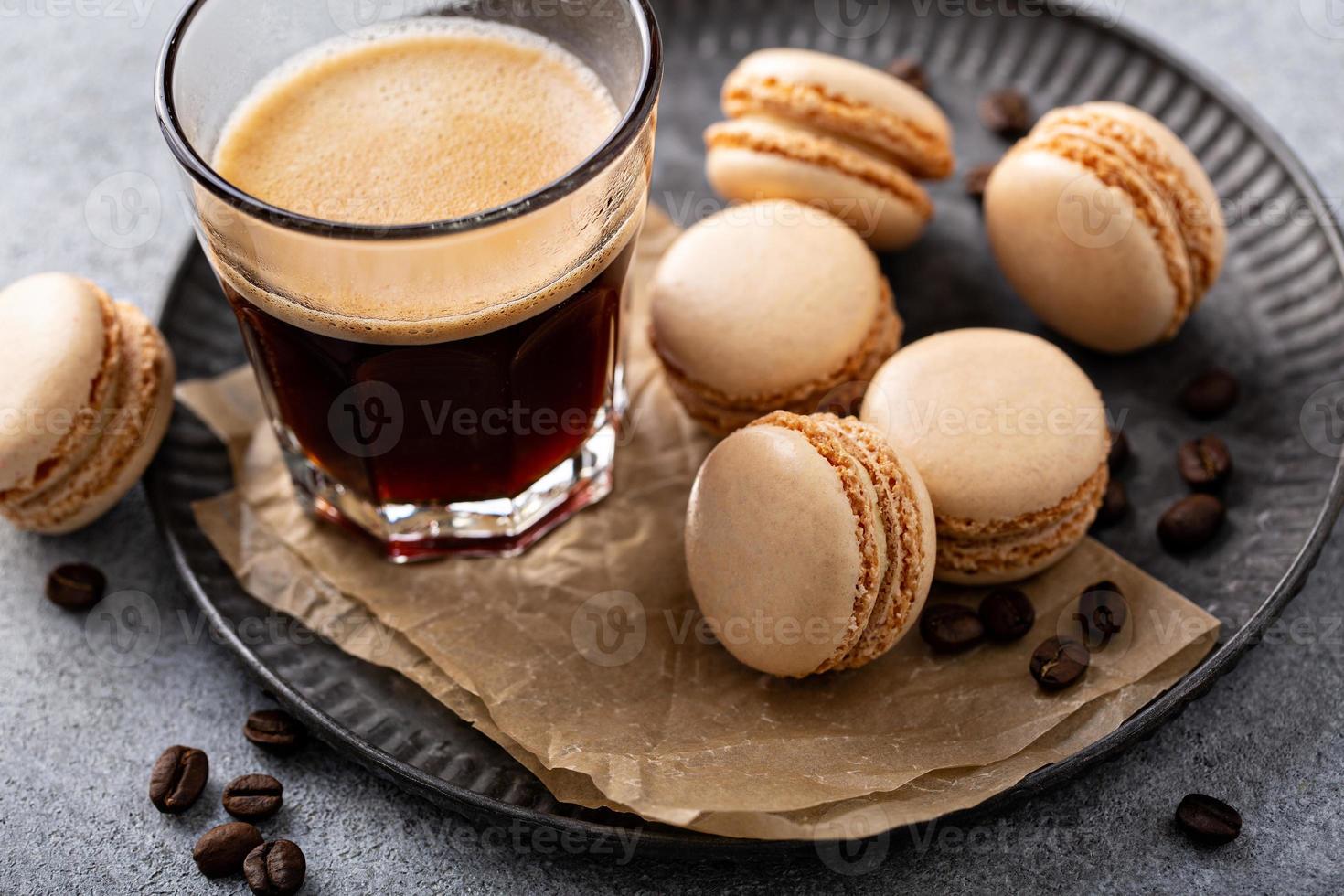 Coffee or chocolate macarons on a tray photo