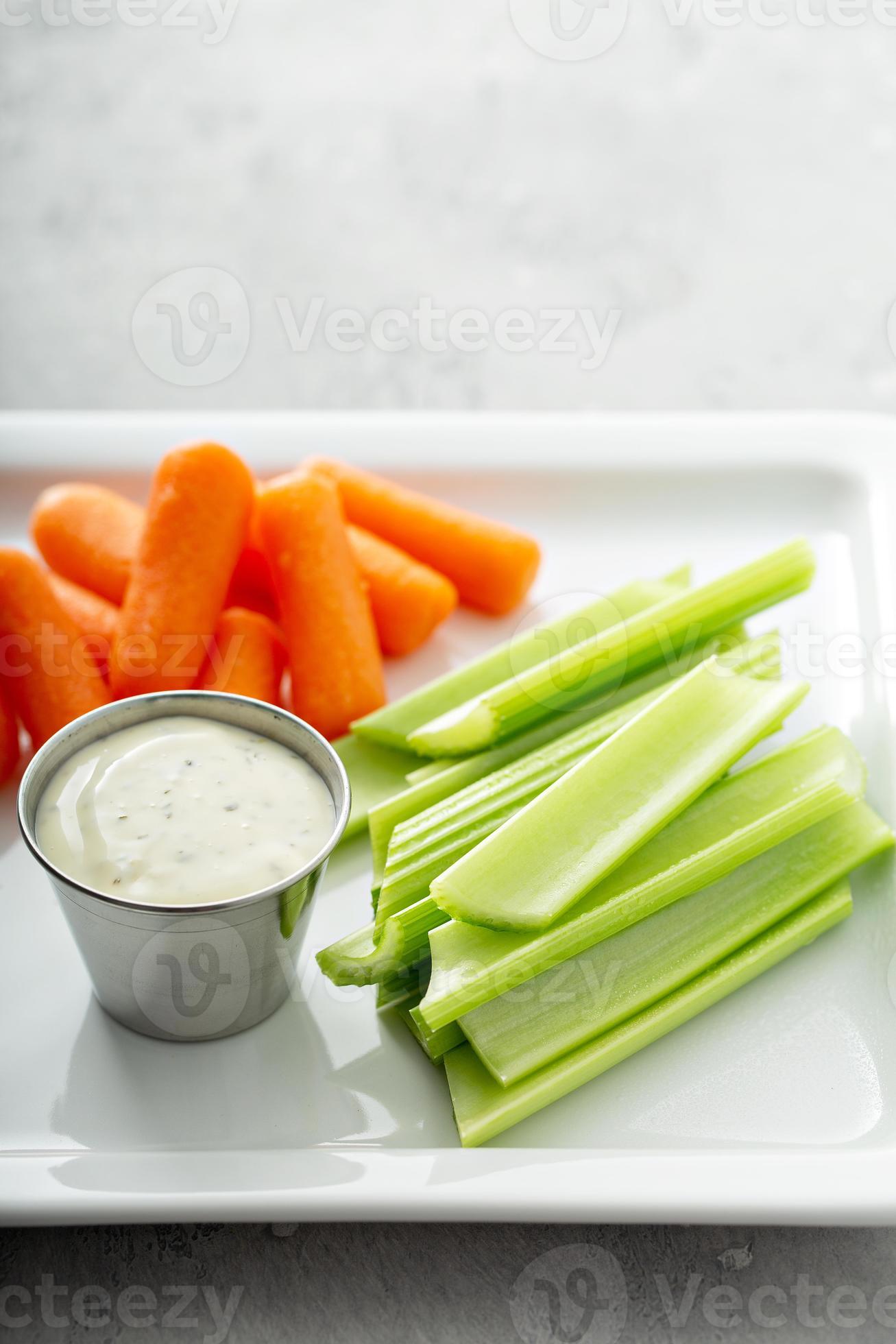 Celery and carrot sticks with ranch 15945396 Stock Photo at Vecteezy