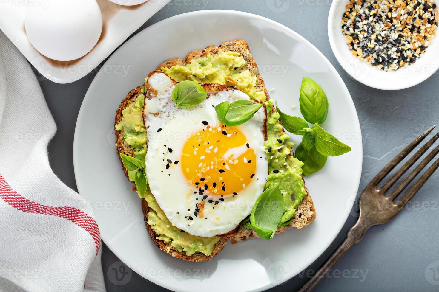 Avocado toast with fried egg photo