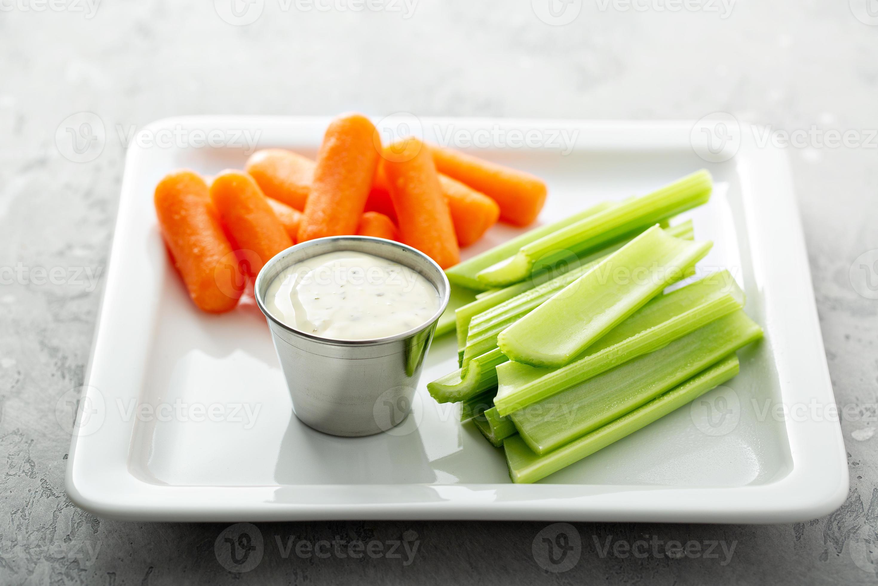 Celery and carrot sticks with ranch 15945634 Stock Photo at Vecteezy