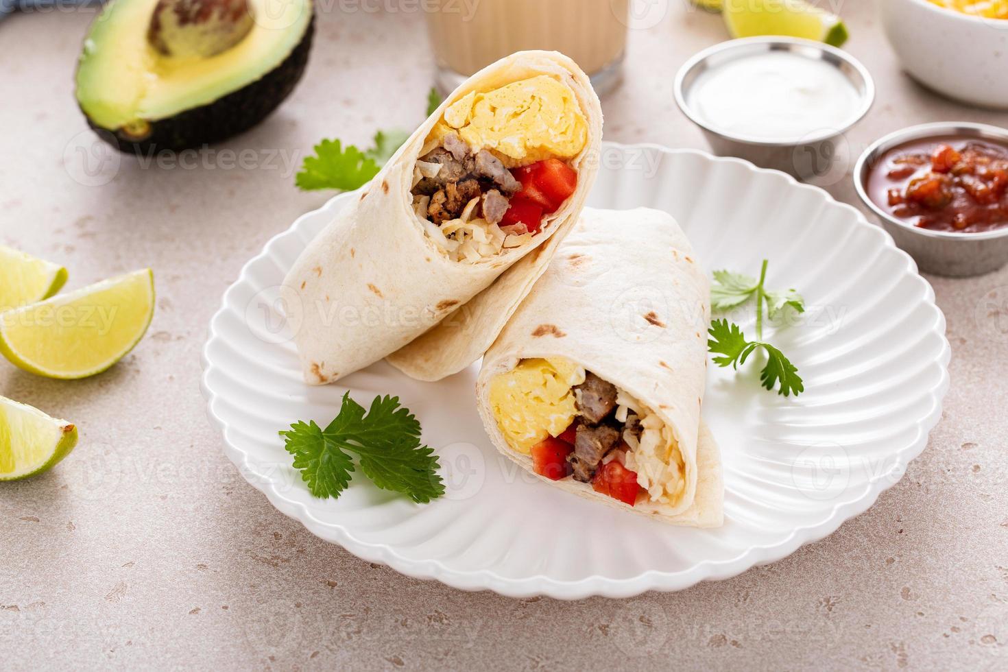 Breakfast burrito with sausage, eggs, bell pepper and cheese photo