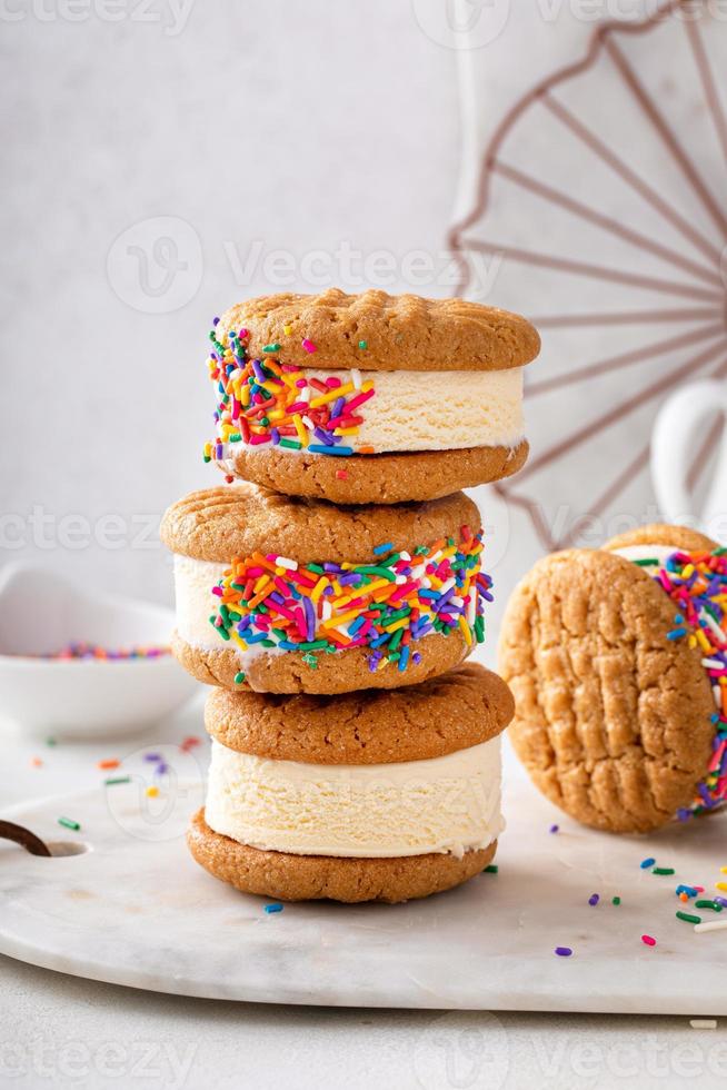 Ice cream and cookies sandwiches stacked on the table photo