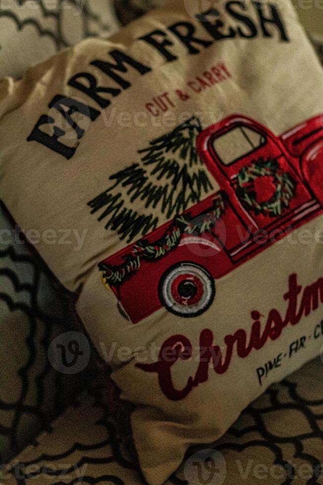 Red Truck with a Christmas Tree in It Christmas Pillow on a Chair photo