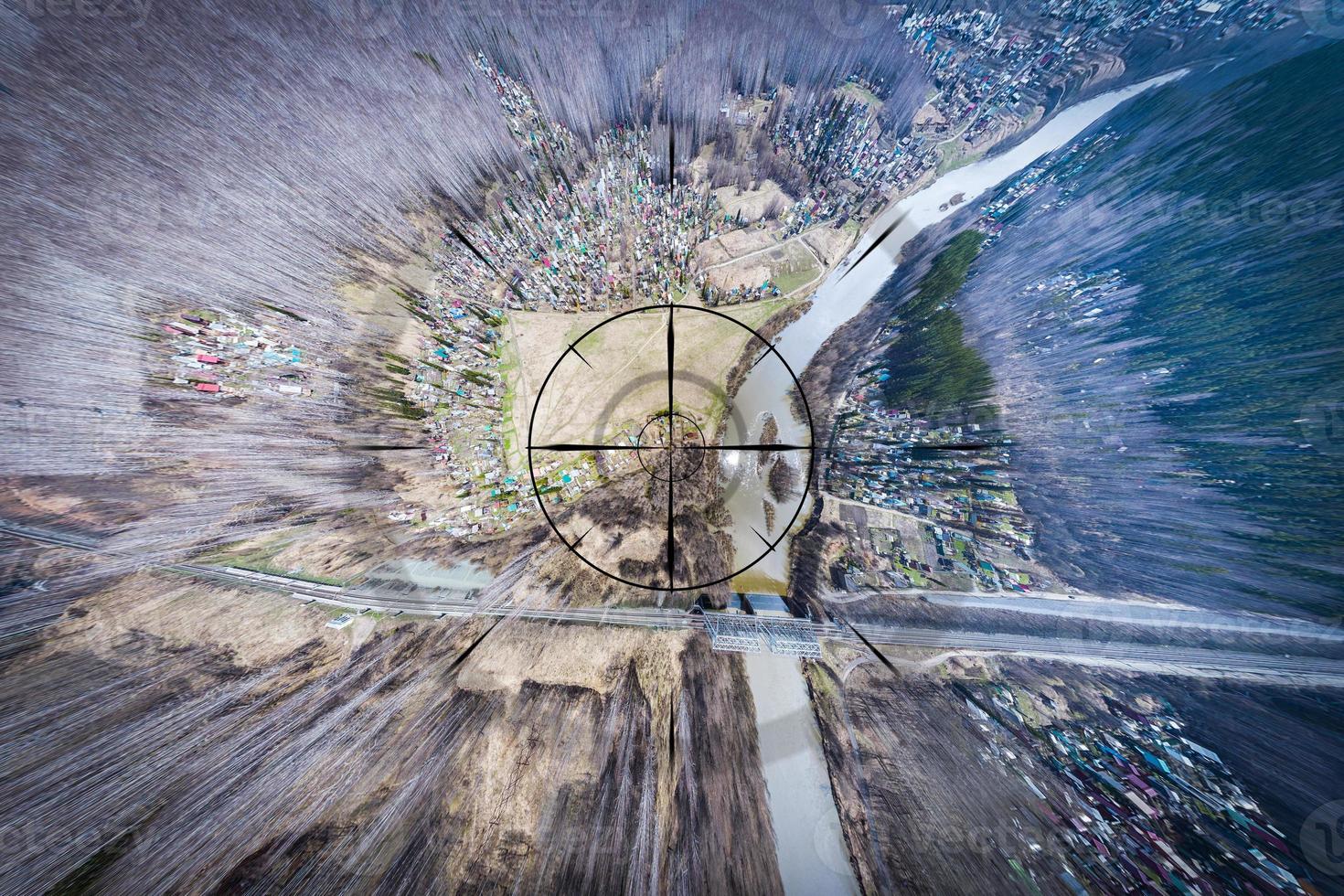 Close-up, a small town, a village with small houses, a river, a bridge, roads and other strategically important objects to be under the gun and shadowed. Concept of computer game and spying on people photo