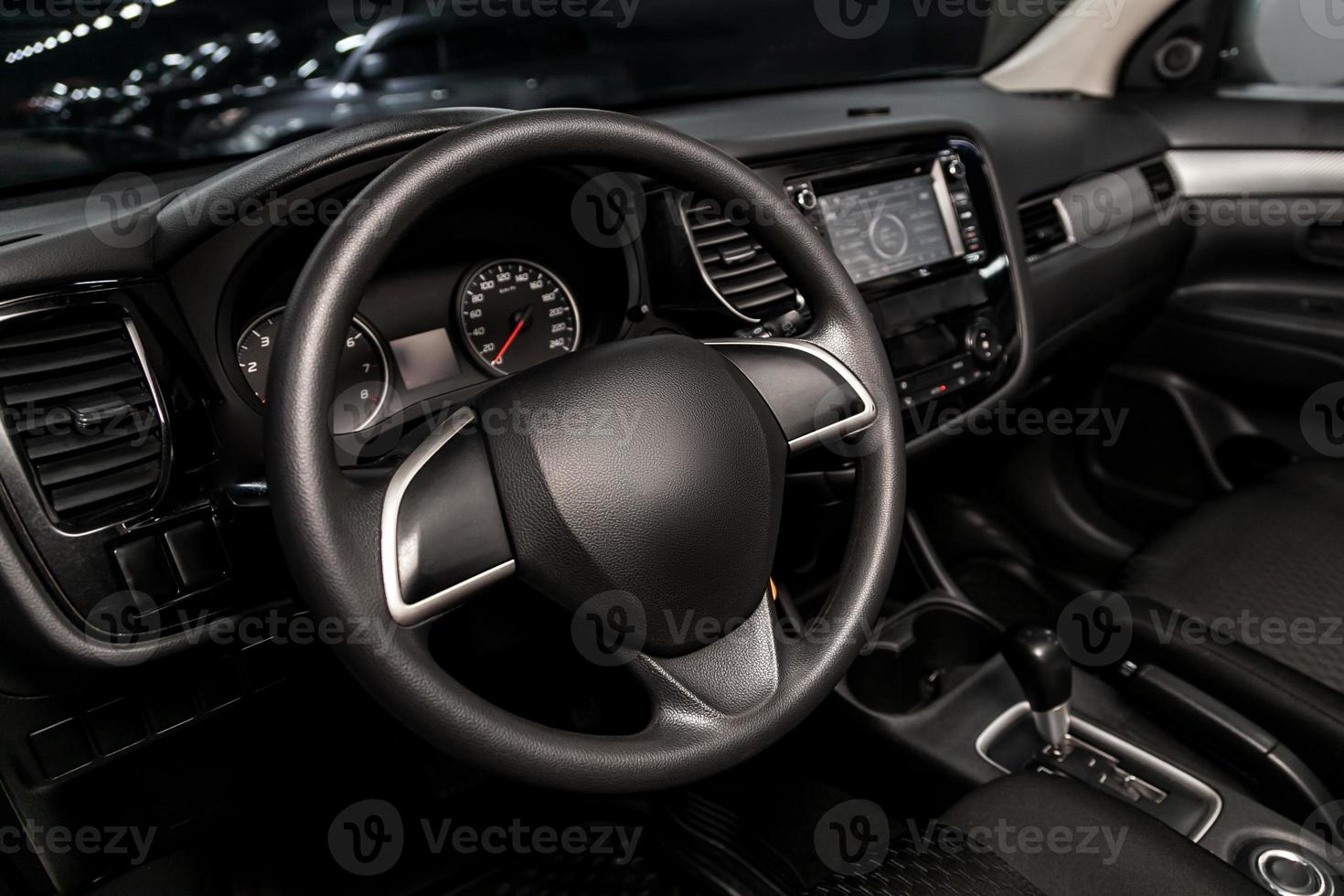 Interior view of car with black salon. Modern luxury prestige car interior photo