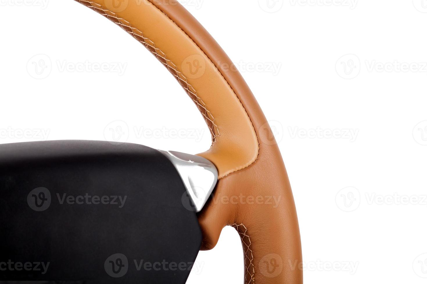 handmade Multifunction wheel made of genuine leather with phone control buttons and other settings on a white isolated background, front view. photo