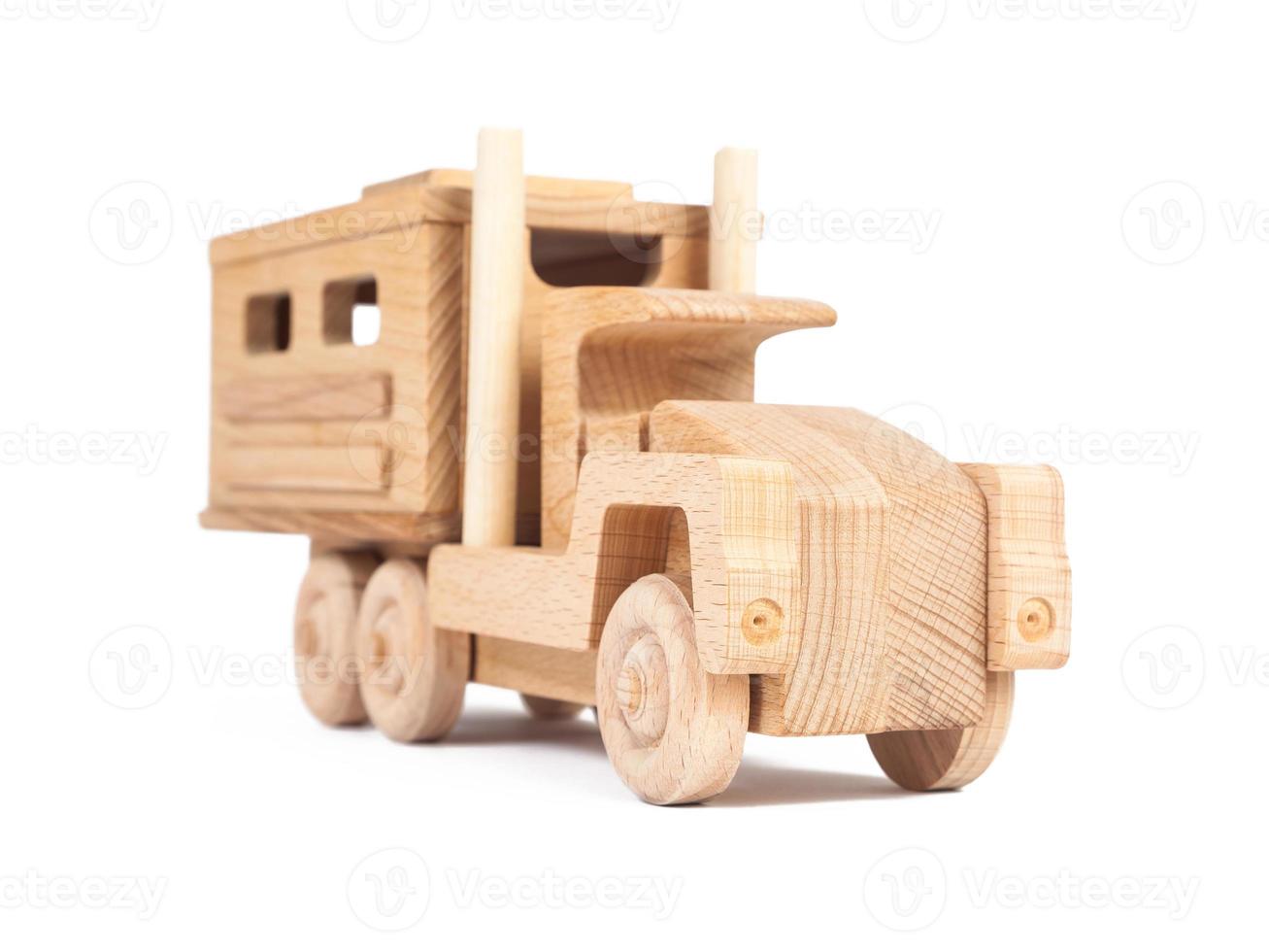 Photo of a wooden car truck made of beech on a white isolated background