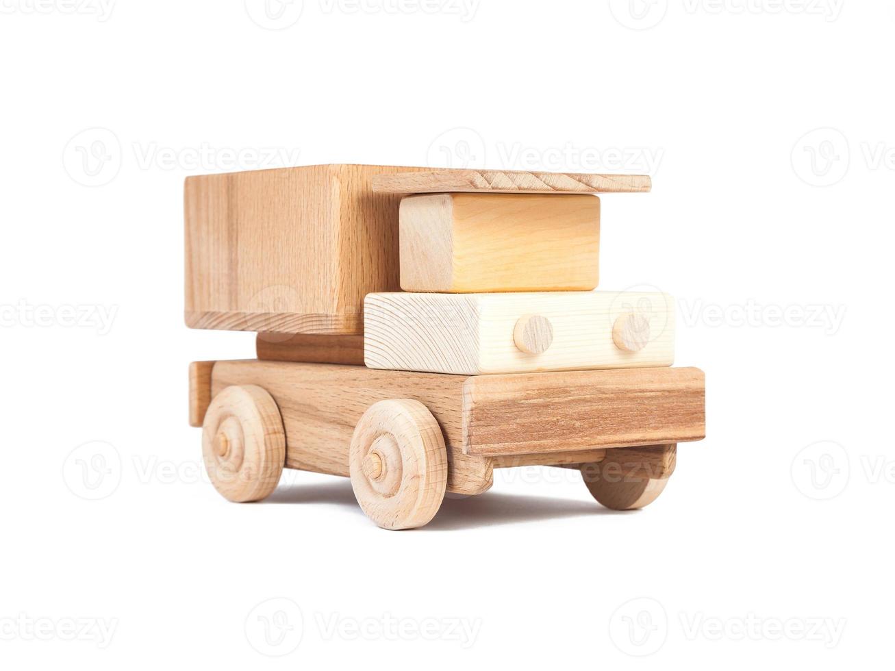 Photo of a wooden car truck made of beech on a white isolated background