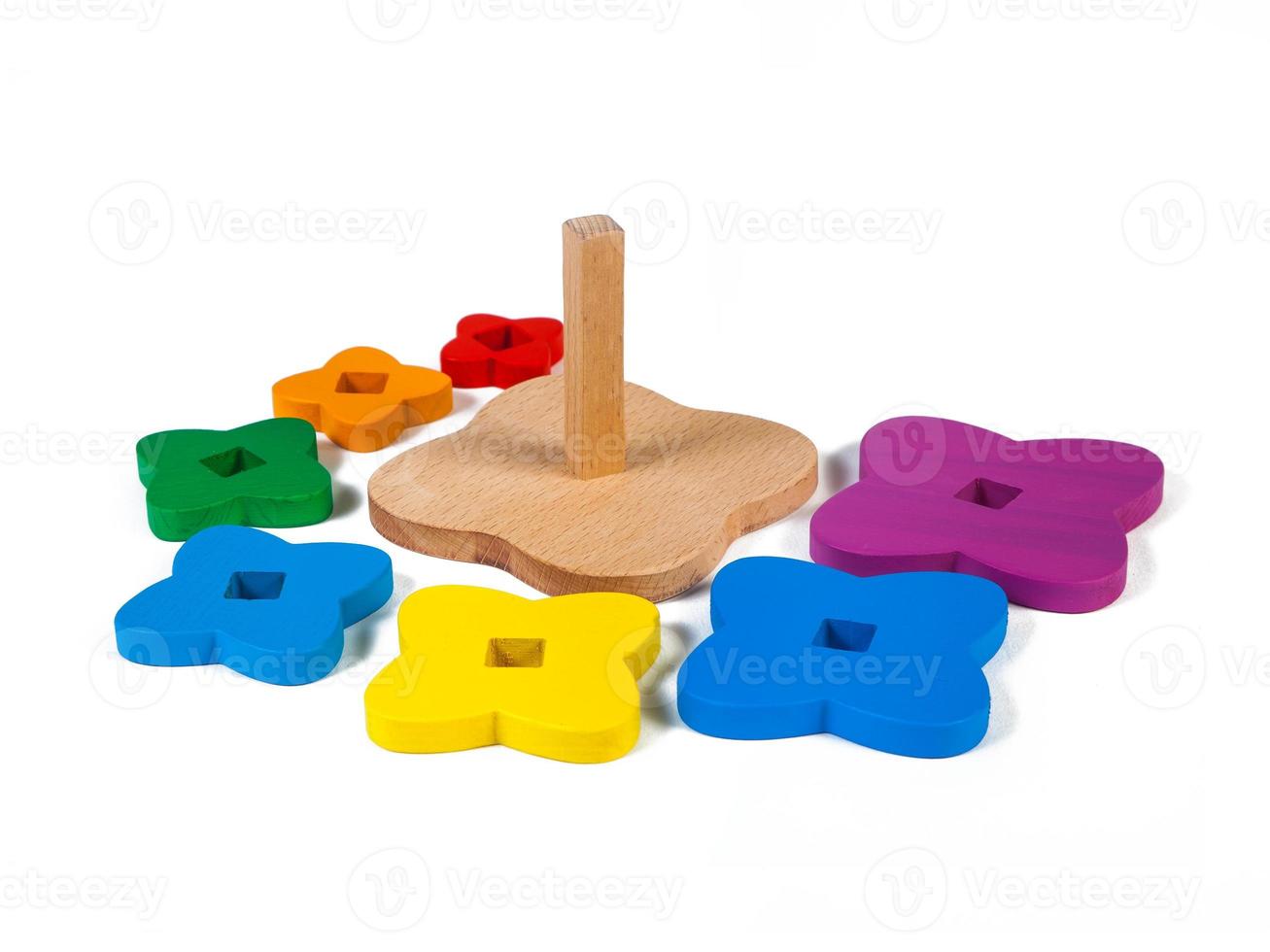 pyramid of colorful parts in the shape of flowerss on a white isolated background. photo